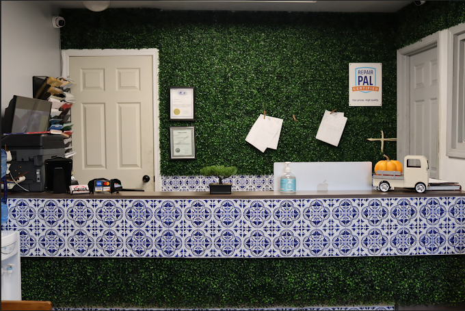 Quiroz Auto Center front desk — RepairPal Certified shop